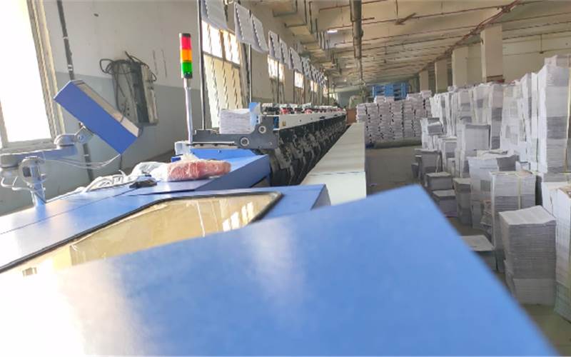 After the installation was complete, there were test runs, and finally what is seen here is the Signa gatherer and signatures ready for action. On the sides are the printed sheets which will take the form of a book one it passes through the binding line