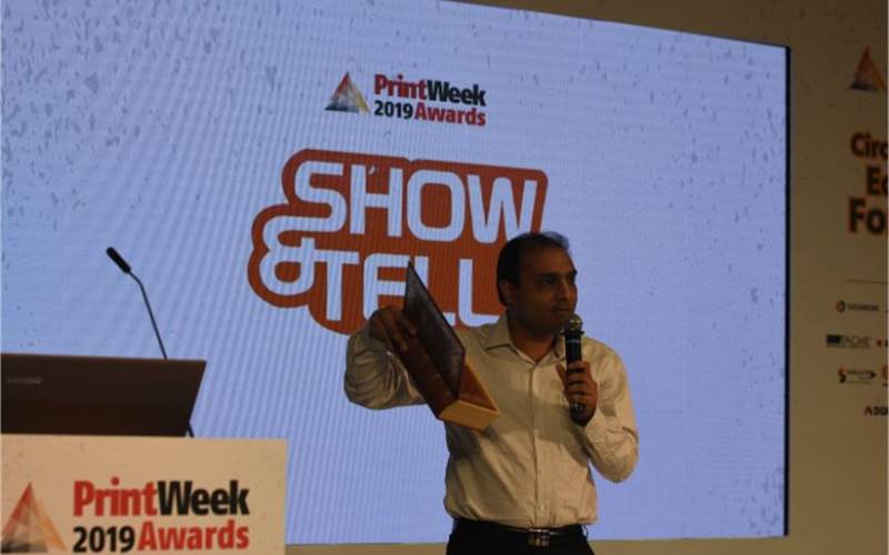 Manu Choudhury of CDC Printers showcases a wedding invite in the form of a book