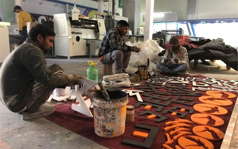 Workers giving finishing touches