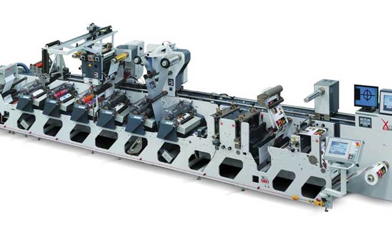 XFlex X4 - Omet: We do not know why Omet named the rewinder X4, like rock ‘n’ roll. Perhaps because of the sound it makes. See this eight-colour servo press with this enhancer, a budget-friendly press, which Omet says has short web path, gearless anilox roll, cold foiling unit, automatic register control system, delam-relam, web turnbar, among other features. Launched at Labelexpo Europe in Brussels in 2011, the machine is capable of handling vast range of materials, from 12 micron films to 250 GSM board.
          Stall No: H19