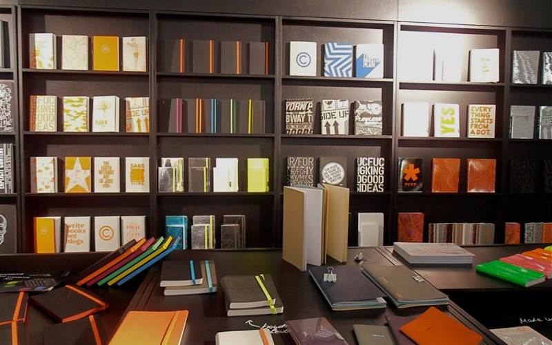 A display of notebooks and art books.
