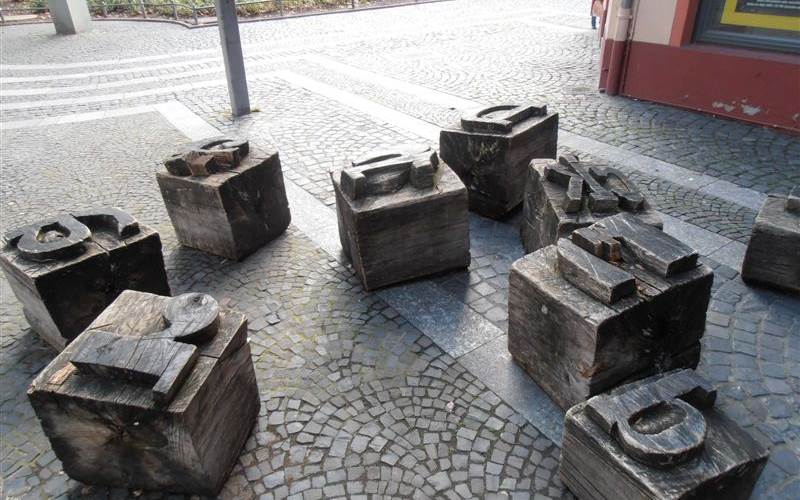 An installation of over-sized moveable types, carved in wood, near the Gutenberg Museum.