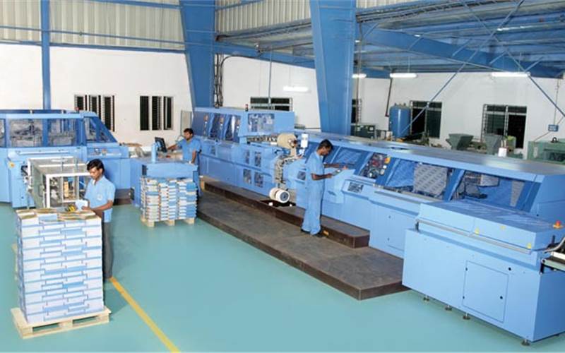 The Diamant MC 35 binder from Muller Martini is deployed for hardcase book binding