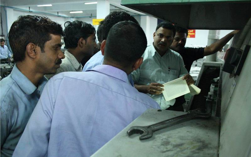 Intricacies of book-binding. The Welbound training session at the Thomson Press in Faridabad