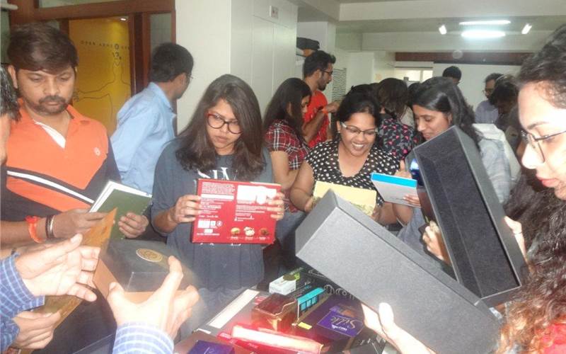 An eager Elephant team studying India's best print samples received during the PrintWeek India Awards 2016