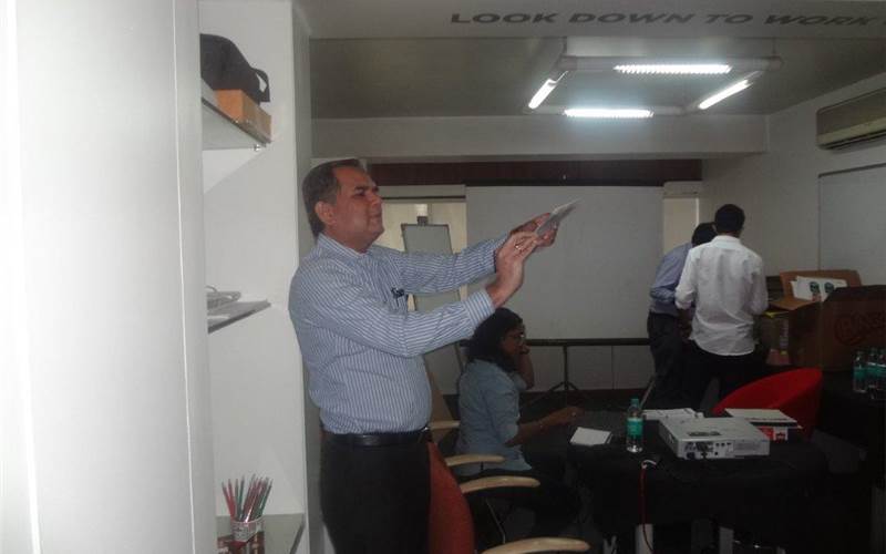 Nitin Wani explaining the guidelines to creating an artwork