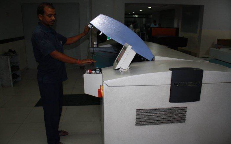Once the pages are finalised, the CTP operator readies the plates for printing