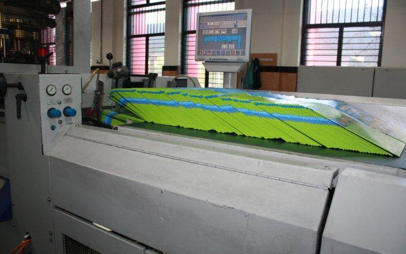 The prepared hard covers are loaded on the case-making machine