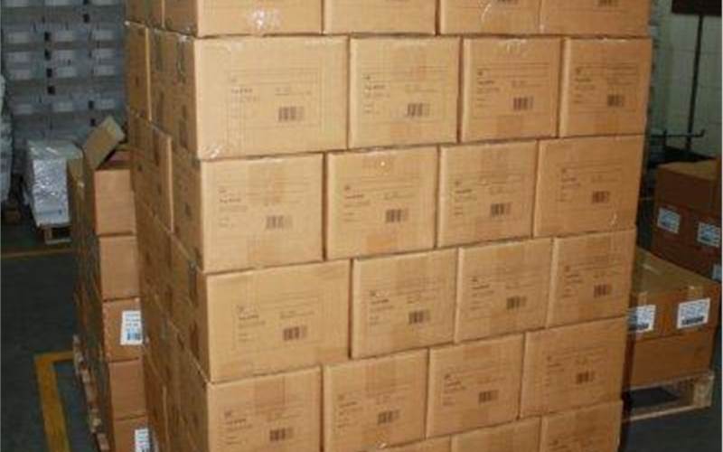 A stack of packed corrugated boxes are ready to be loaded and shipped. Replika has a capacity to produce 1,15,000 books per day