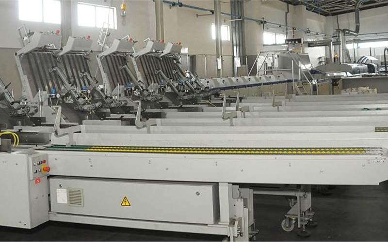 The Kolbus has a clamp size of 510mm which can take two-up textbooks, coupled with a slitting unit and two three knife trimmers