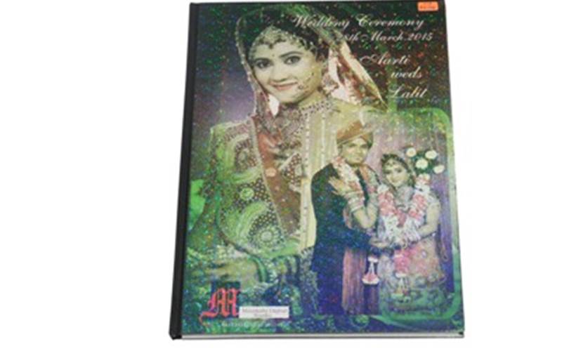 THOMSON PRESS | New DelhiPre-Press:  Picture colour correcion and manipulation
          Press: HP Indigo 5500 (Four colour 120 dpi using HP Indigo electro ink with colour gamut that simulates 90% Pantone colour by using orange violet+ CMYK)Post-Press: High gloss lamination, strip binding, and hard case die cuttingPaper: 120 gsm NTR metalic paperSpecial feature: Sparkle cover