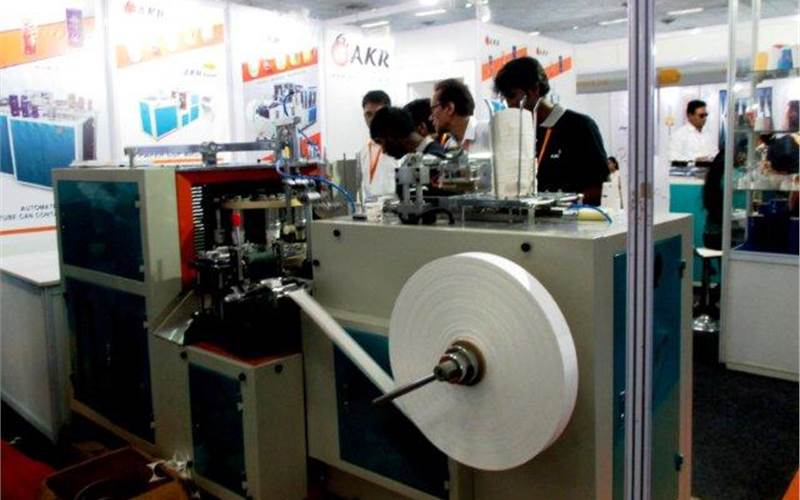 AKR Machinery distributes a large selection of paper cup manufacturing machines. The equipment line includes side speed, single side PE, double side PE, and aluminum foil container manufacturing machines of various models, among others. Products on display included AKR automatic paper tube can container machine, AKR smart paper cup machine