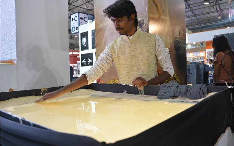 A sand artist from Telangana who turned on his art form at the HP stall
