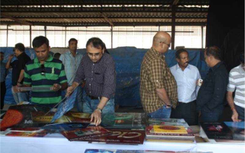 Amol Paranjape, senior creative director, production and studio of JWT closely looking at the samples. He was amazed that printing has "evolved and is not the same as it was 10 years ago"