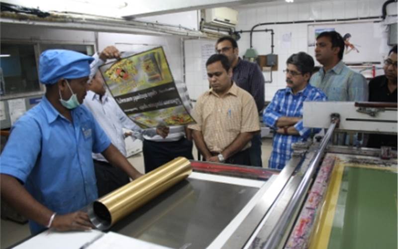 Rajgopal explaining how plastic substrates can be printed using screen printing technology