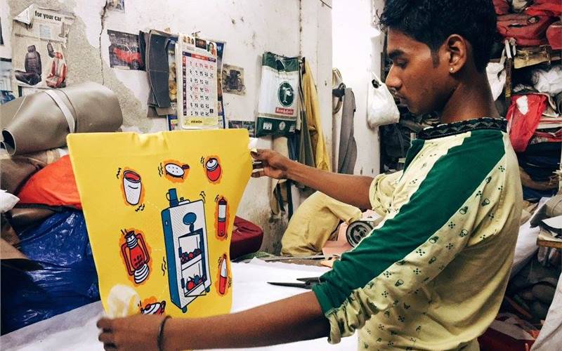 They use the process of sublimation, done through heat transfer, for printing. They first print on transfer paper on a regular Epson printer, and the design is then pressed onto the fabric