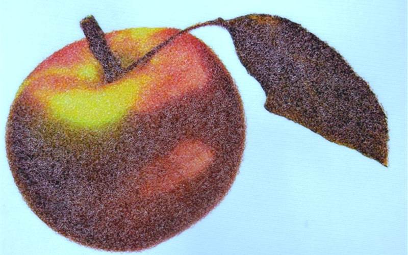 The bead print effect is achieved by printing CMYK colour by a single stroke and PVC beads placed manually on the wet film and cured