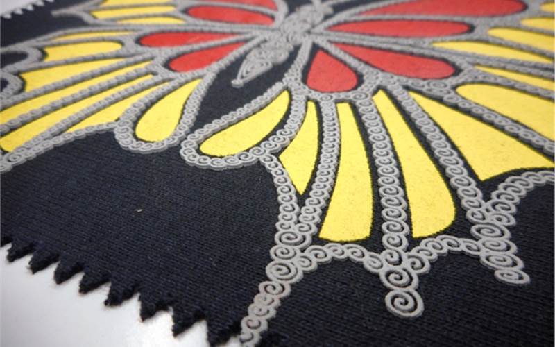 The high density raised print effect achieved by three colours printed onto the textile with Sericol's ink