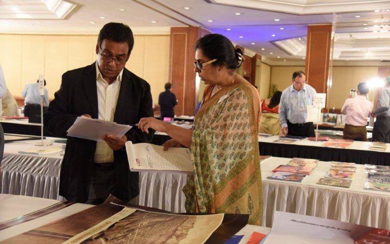 Jury members interact and discuss print samples during the judging process