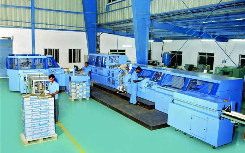 The Diamant MC 35 binder from Muller Martini is deployed for hardcase book binding