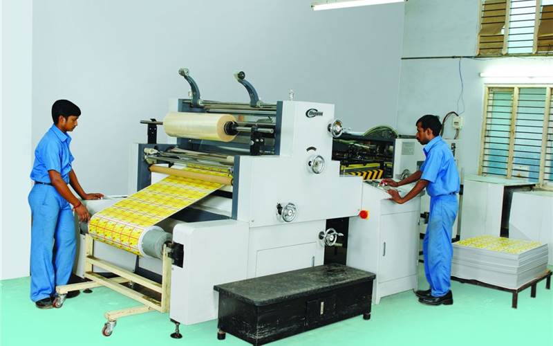 The Champion automatic cold lamination machine is a part of battery of hot and cold lamination kit on its shopfloor.