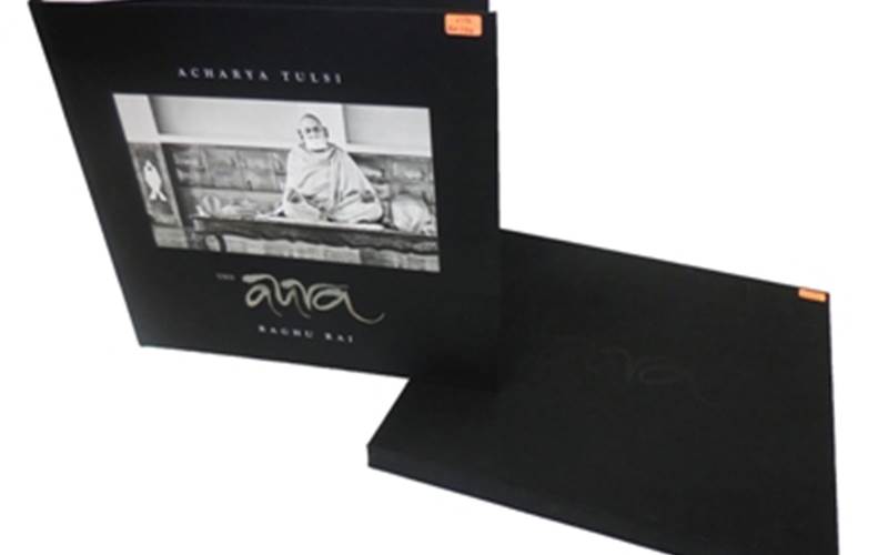 PRAGATI OFFSET | The AuraLength of run: 2100Art: Tritones (Grey + two Blacks)Pre-Press: Separated IB tritones (Grey + two blacks). Output on CTP using 250lpi screeningPress: Mitsubishi Diamond 3000Post-Press: Section-sewn and hardcase bound. Tipped-in letter at the beginning of the book. Case and slipcase made with black cloth. White screen printing, debossing and dark metal cut piece pasting on hardcase. Sleeve in blind debossedPaper: Natural Evolution