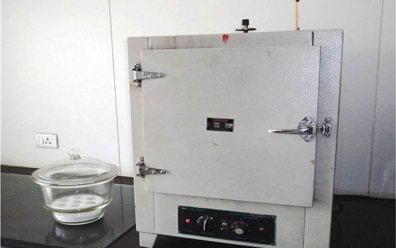 A temperature regulated, air ventilated oven, tests the moisture content of paper and boards and solid content of adhesives.