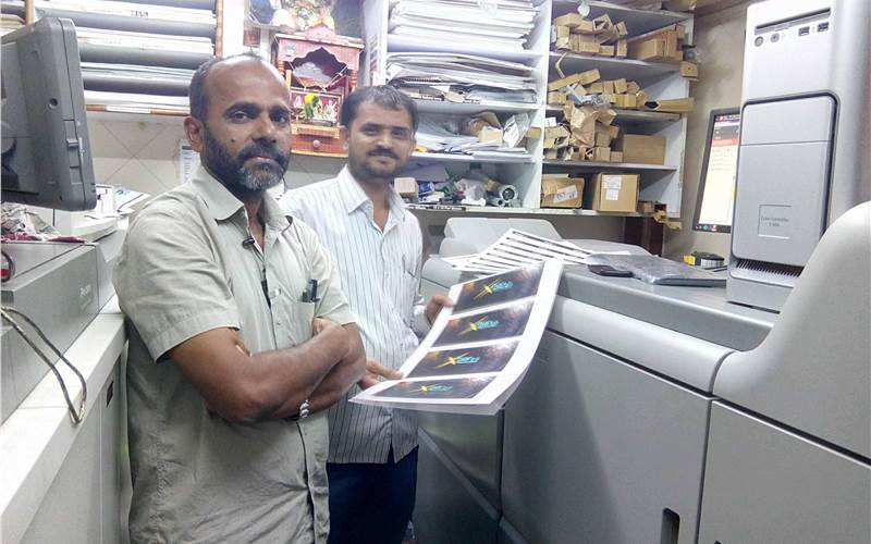 (l-r) Saji and Dangar of Aakarsh Print-O-Graph, Mumbai, have installed its second Ricoh digital press, a C7100x with a fifth colour station