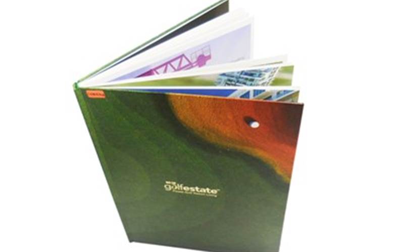 LUSTRA PRINT PROCESS | Golf estate brochureLength of run: 2000Pre-Press: Agfa Apogee workflow and Screen CTP systemPress: Ryobi 925 (five-colour + online aqueous coater)Post-Press: Abrasive UV effect on the cover and metal deposition on the cover, die-cutting, and pocket pastingPaper: 190gsm Rendezvous Super White for the inside pages and pocket, and 160gsm Rendezvous Super White pasted on 2.5mm mill board for the cover