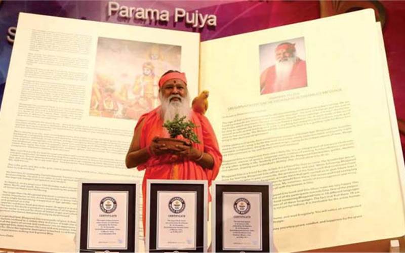 Sri Ganapathy Sachchidananda Swamiji with the world's largest Bhagavad Gita