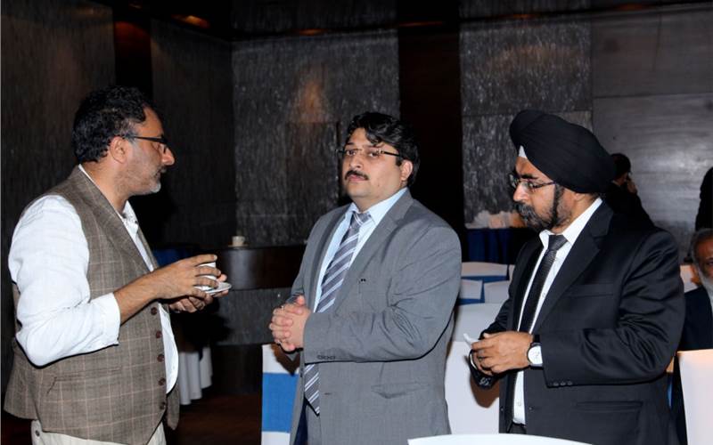 Puneet Datta (c) and Gurjeet Dhingra of Canon India (r) crunching data in the digital print segment with Ramu Ramanathan (l) of PrintWeek India