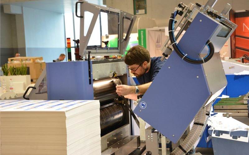 Bograma’s die-cutting and finishing kit. Here the operator is loading a magnetic die-cutting tool. The Competence3 stand sees, MBO and Herzog & Heymann besides Bograma